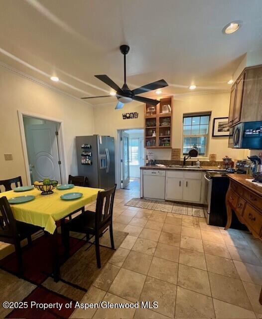 337 W Ave, Rifle, CO 81650 - kitchen with ornamental molding, dark countertops, refrigerator with ice dispenser, a ceiling fan, and dishwasher