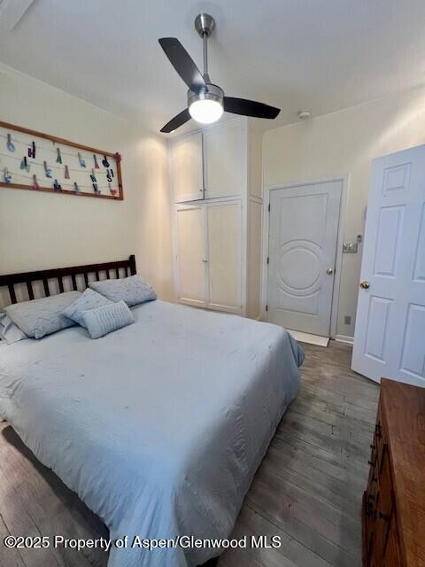 337 W Ave, Rifle, CO 81650 - bedroom with wood finished floors and a ceiling fan