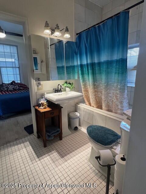 337 W Ave, Rifle, CO 81650 - full bath featuring tiled shower / bath, tile patterned flooring, and vanity