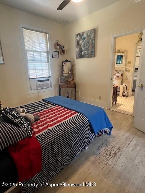 337 W Ave, Rifle, CO 81650 - bedroom with hardwood / wood-style floors, cooling unit, and ceiling fan