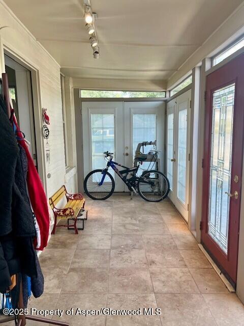 337 W Ave, Rifle, CO 81650 - sunroom with french doors, tile patterned floors, and rail lighting