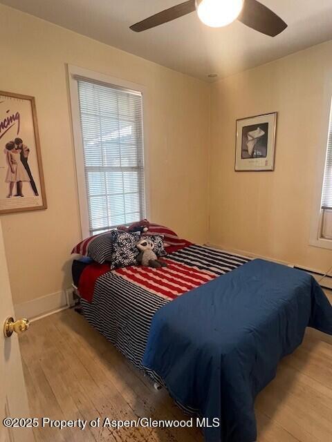 337 W Ave, Rifle, CO 81650 - bedroom with wood finished floors and ceiling fan