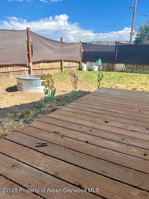 337 W Ave, Rifle, CO 81650 - wooden terrace with a fenced backyard