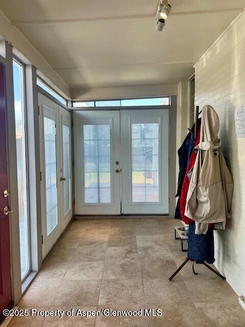 337 W Ave, Rifle, CO 81650 - entryway featuring french doors, plenty of natural light, and light tile patterned floors