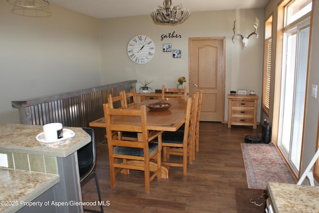 22 Booms Pl, Rifle, CO 81650 - dining area featuring dark wood-type flooring and a chandelier