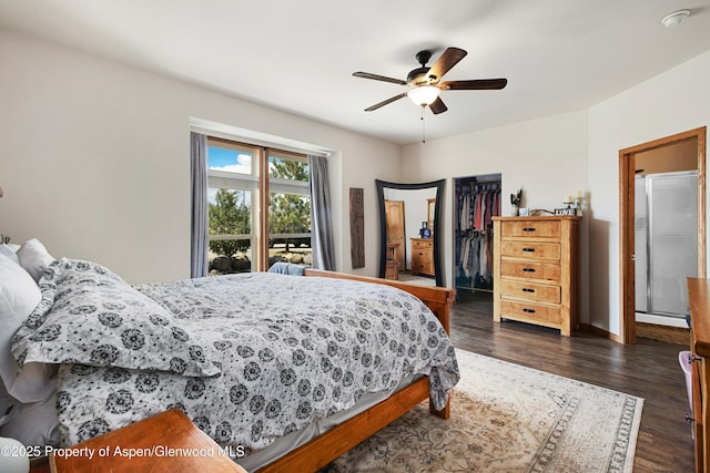 22 Booms Pl, Rifle, CO 81650 - bedroom featuring a walk in closet, dark wood finished floors, and ceiling fan