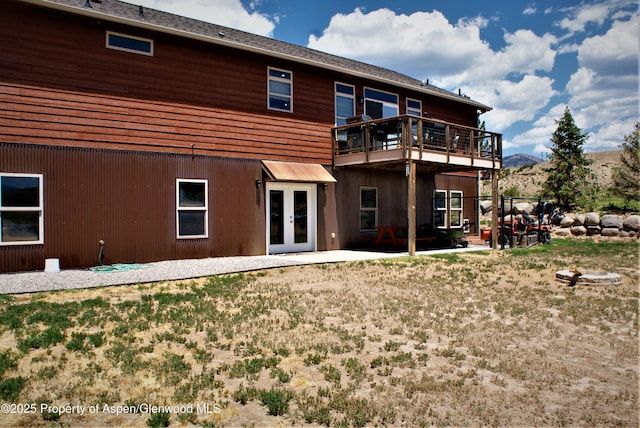 22 Booms Pl, Rifle, CO 81650 - rear view of house with french doors and a mountain view