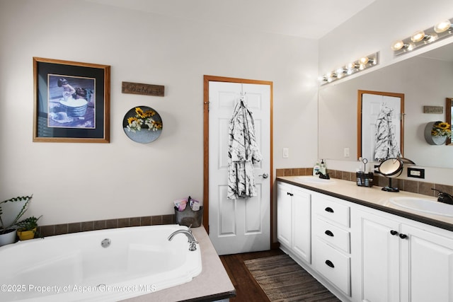 22 Booms Pl, Rifle, CO 81650 - bathroom featuring double vanity, a bath, and wood finished floors