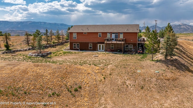22 Booms Pl, Rifle, CO 81650 - rear view of house with french doors, a deck with mountain view, and a patio