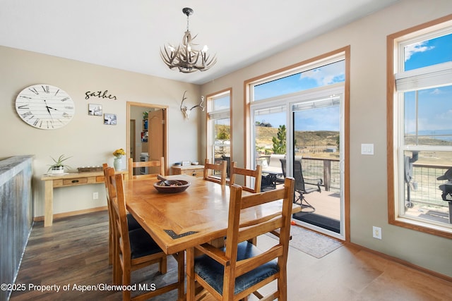 22 Booms Pl, Rifle, CO 81650 - dining room featuring a chandelier and healthy amount of natural light