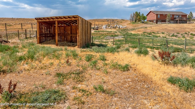 22 Booms Pl, Rifle, CO 81650 - view of yard with an outbuilding, an outdoor structure, and a view of countryside