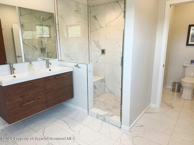 bathroom featuring toilet, vanity, and tiled shower