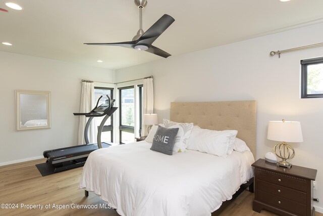 bedroom featuring ceiling fan and light hardwood / wood-style floors