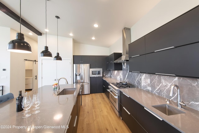 kitchen with appliances with stainless steel finishes, backsplash, decorative light fixtures, and sink