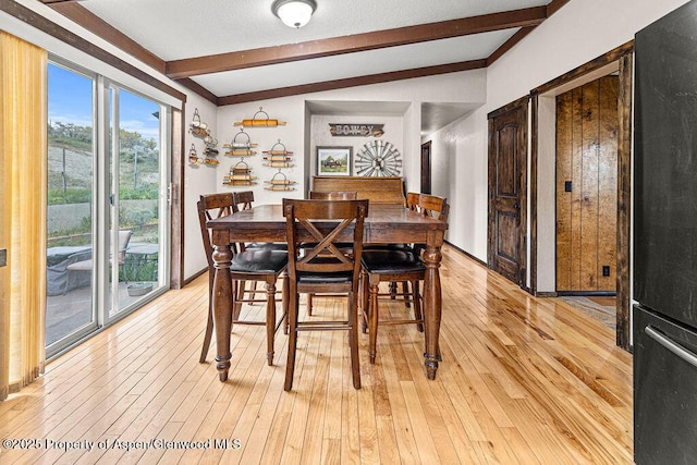 3598 County Road 35, Craig, CO 81625 - dining space featuring beamed ceiling and light wood-style flooring