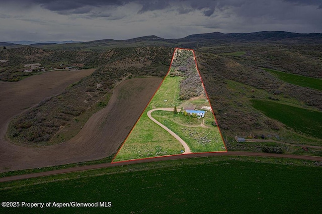 3598 County Road 35, Craig, CO 81625 - aerial overview of property's location featuring property parcel outlined and a mountainous background