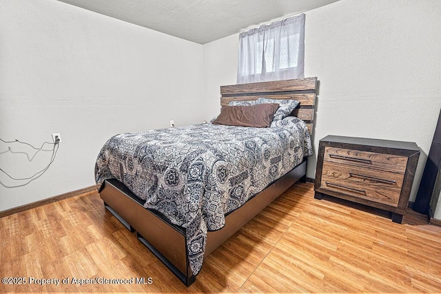 3598 County Road 35, Craig, CO 81625 - bedroom with wood finished floors and baseboards
