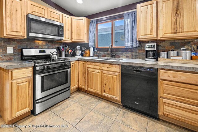 3598 County Road 35, Craig, CO 81625 - kitchen featuring appliances with stainless steel finishes, a sink, light brown cabinets, backsplash, and recessed lighting
