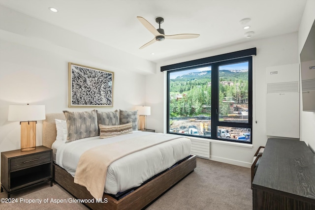 carpeted bedroom featuring ceiling fan