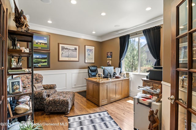 office space with light hardwood / wood-style flooring and ornamental molding