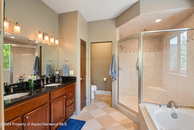 full bathroom featuring vanity, toilet, and shower with separate bathtub