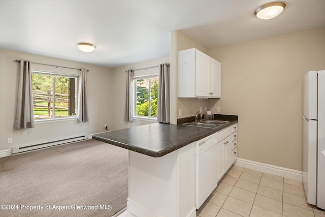 kitchen with sink, light tile patterned floors, baseboard heating, white cabinetry, and kitchen peninsula