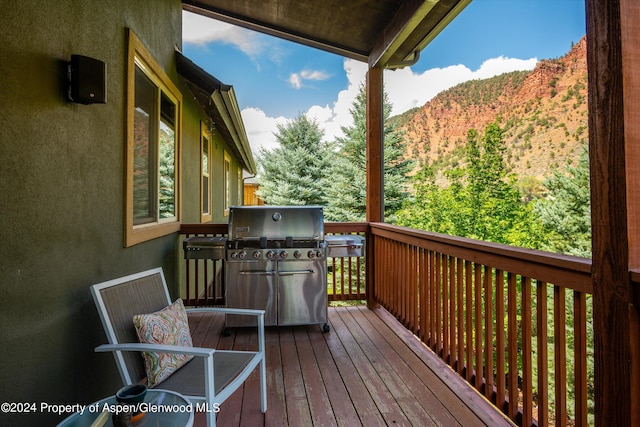 deck with a mountain view and a grill