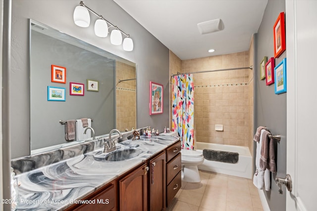 full bathroom featuring tile patterned flooring, vanity, shower / bath combo, and toilet