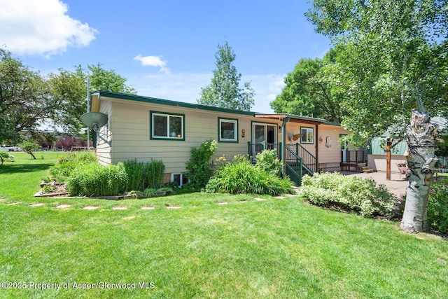 ranch-style home featuring a patio and a front lawn