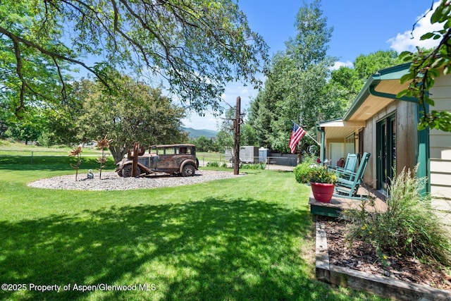 view of yard with fence