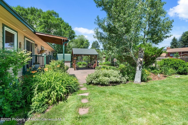 view of yard featuring fence and a patio area