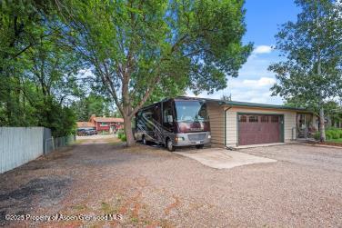 exterior space with driveway and fence