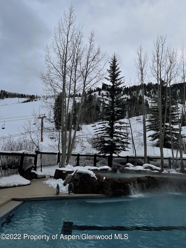 view of snow covered pool