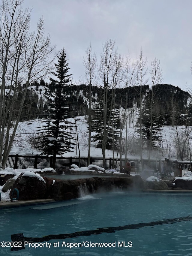 view of snow covered pool