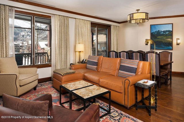 living room featuring dark hardwood / wood-style floors and ornamental molding