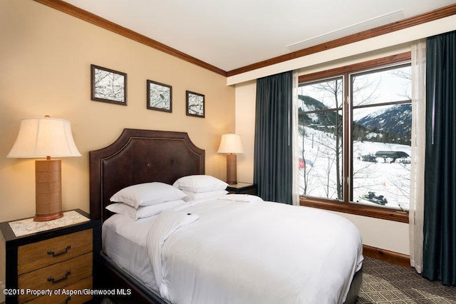 bedroom with a mountain view and ornamental molding