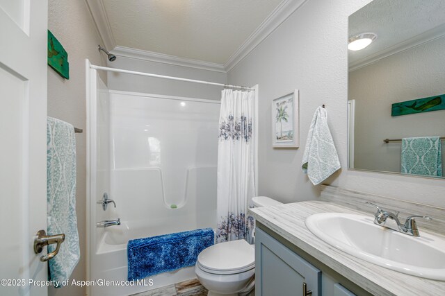10155 6400th Rd, Montrose, CO 81401 - full bathroom featuring toilet, shower / bath combo with shower curtain, ornamental molding, a textured ceiling, and vanity