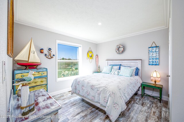 10155 6400th Rd, Montrose, CO 81401 - bedroom with ornamental molding, wood finished floors, and baseboards