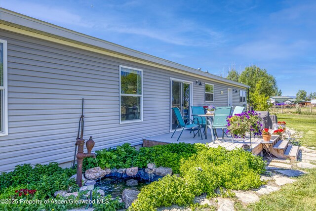 10155 6400th Rd, Montrose, CO 81401 - back of house featuring a wooden deck