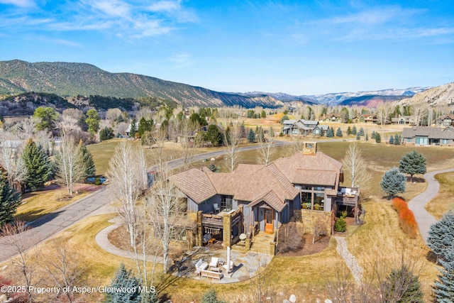 drone / aerial view featuring a mountain view