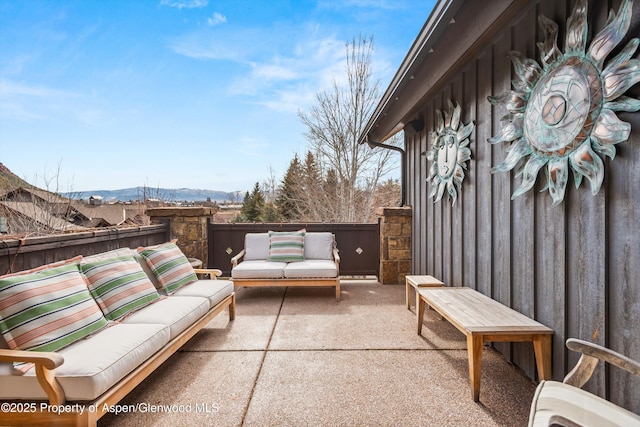 view of patio with outdoor lounge area and a mountain view