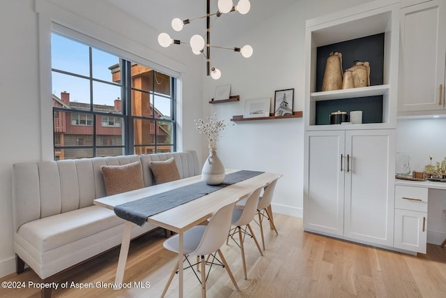 dining space featuring breakfast area and light wood-type flooring