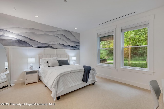 bedroom featuring light carpet