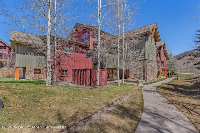 view of property exterior with a yard