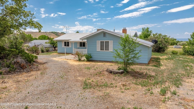 12303 W Spring Cir, Eckert, CO 81418 - view of front of home featuring a metal roof and a chimney