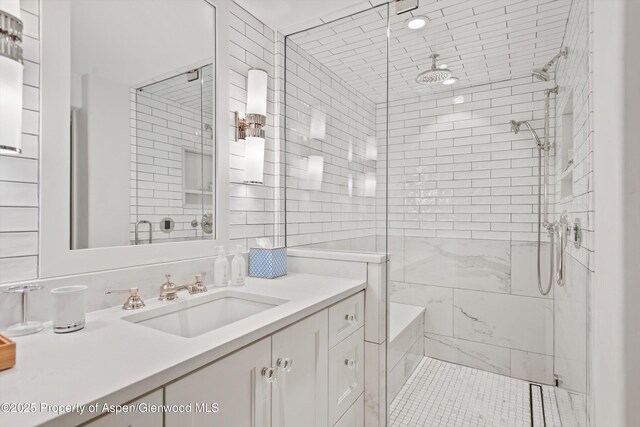650 S Monarch St Unit 10, Aspen, CO 81612 - bathroom with a stall shower, vanity, and tile walls