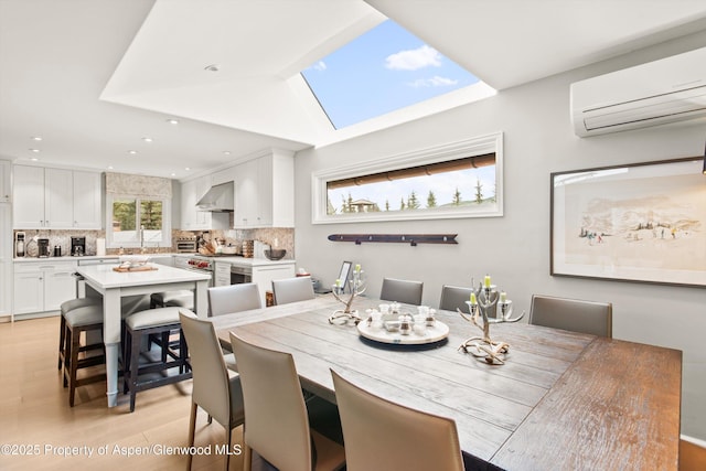 650 S Monarch St Unit 10, Aspen, CO 81612 - dining area featuring a wall mounted air conditioner, light wood finished floors, a skylight, and recessed lighting