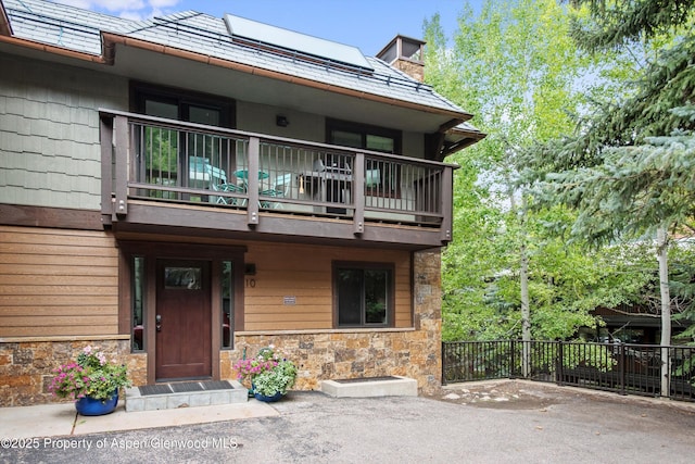 650 S Monarch St Unit 10, Aspen, CO 81612 - view of front of property featuring a balcony and stone siding