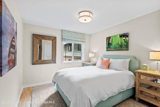 650 S Monarch St Unit 10, Aspen, CO 81612 - bedroom featuring baseboards and wood finished floors
