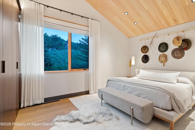411 Wood Rd Unit 10, Snowmass Village, CO 81615 - bedroom with light wood-style floors, lofted ceiling, recessed lighting, and wood ceiling